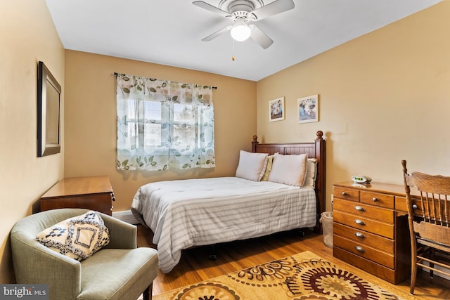 bedroom featuring ceiling fan and wood finished floors