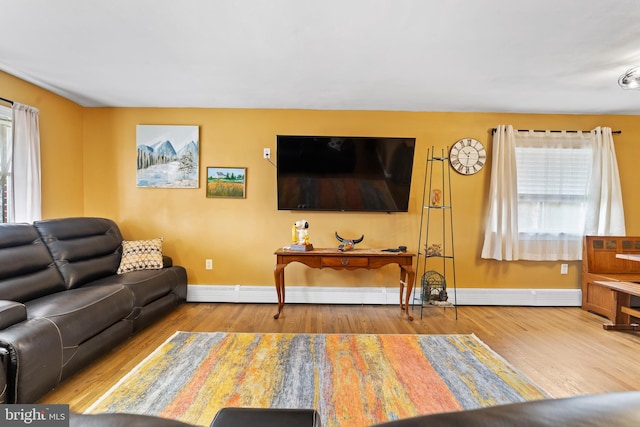 living room featuring baseboards and wood finished floors