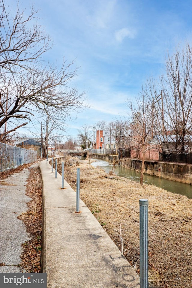 view of home's community featuring a water view