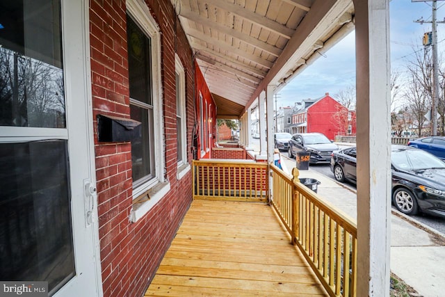 wooden deck featuring covered porch