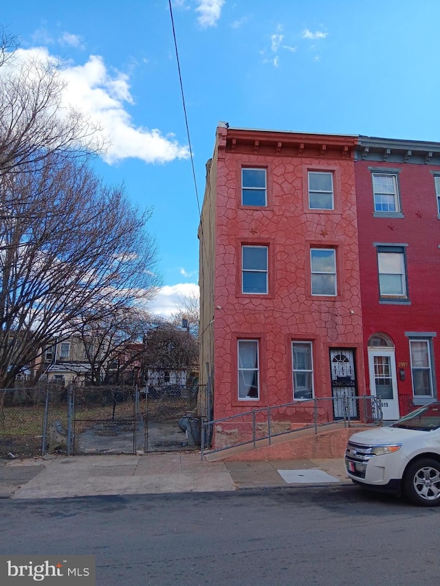 view of property featuring a fenced front yard