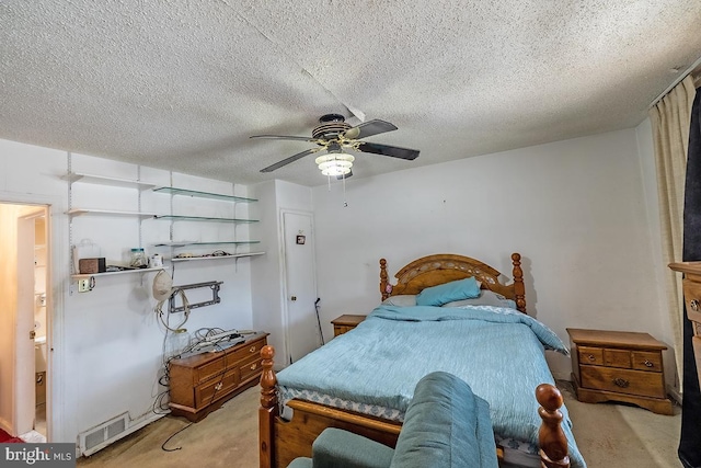 bedroom with light carpet, a textured ceiling, and a ceiling fan