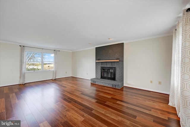 unfurnished living room featuring a fireplace, baseboards, dark wood-type flooring, and ornamental molding