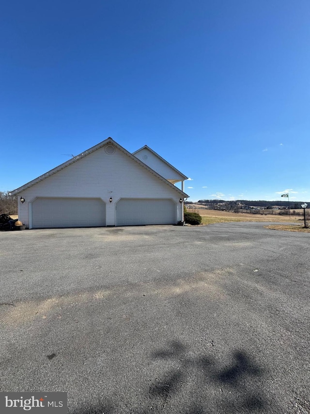 view of home's exterior with driveway