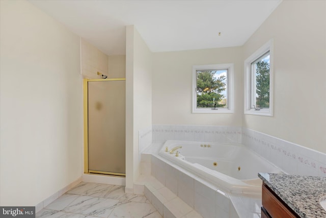 full bathroom featuring a shower stall, marble finish floor, vanity, and a jetted tub