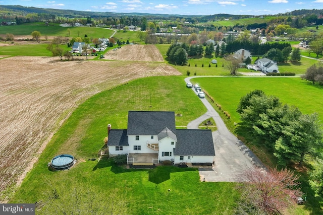 birds eye view of property featuring a rural view