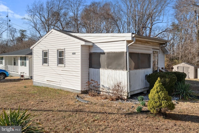 view of property exterior featuring a yard