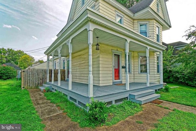 view of side of home featuring a porch