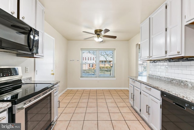 kitchen featuring decorative backsplash, white cabinets, and black appliances