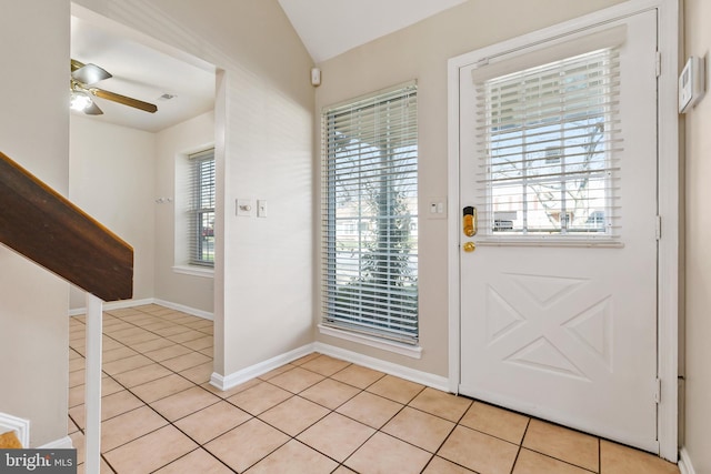 entrance foyer with light tile patterned floors, baseboards, and a ceiling fan