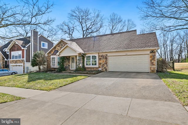 view of front of property featuring a shingled roof, a front yard, a garage, stone siding, and driveway