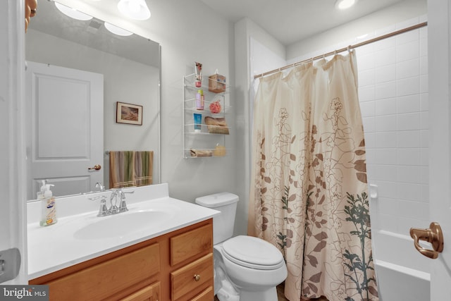 full bathroom featuring vanity, toilet, and shower / bathtub combination with curtain