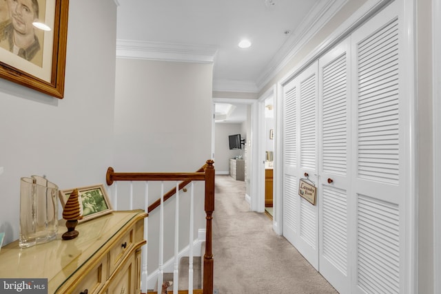 hallway with light carpet, an upstairs landing, recessed lighting, and crown molding