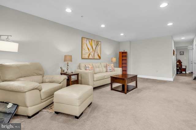 living room featuring recessed lighting, baseboards, and carpet floors