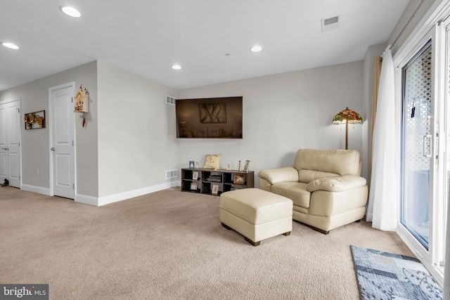 living area with visible vents, recessed lighting, baseboards, and carpet floors