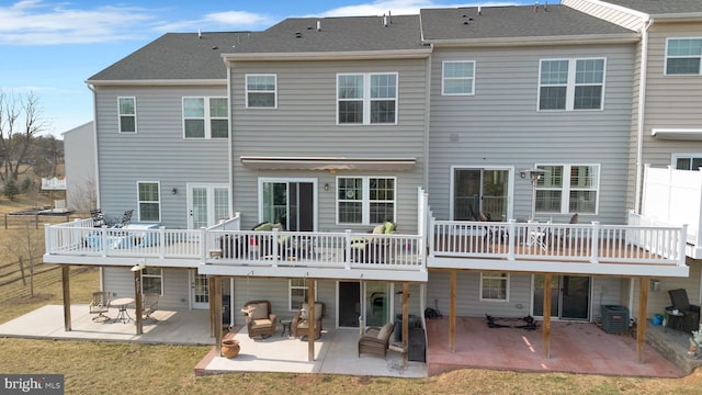 back of house featuring a patio, central AC unit, and a wooden deck