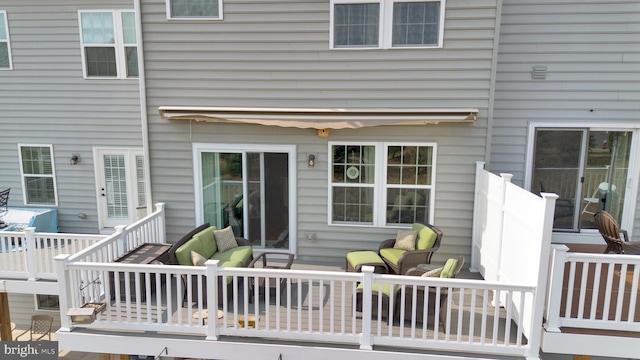 deck featuring outdoor lounge area