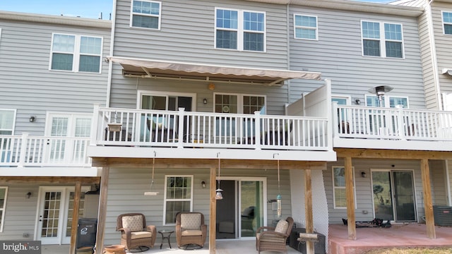 back of house with a patio