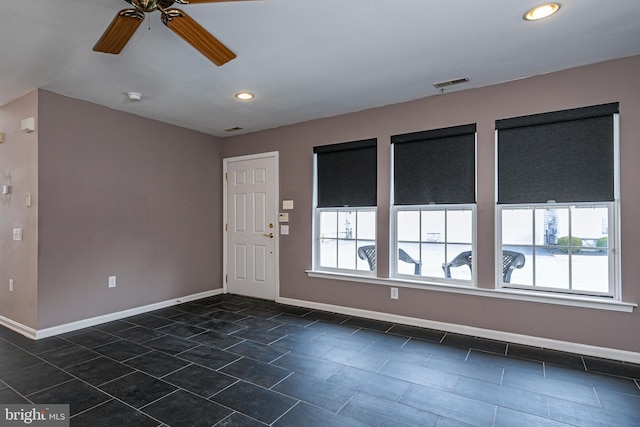 spare room with recessed lighting, visible vents, ceiling fan, and baseboards