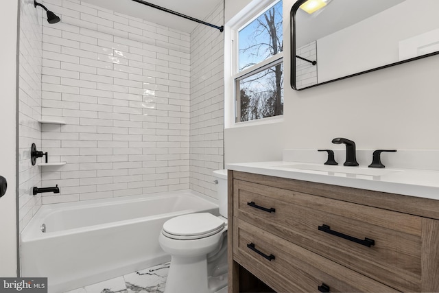 full bath featuring marble finish floor, tub / shower combination, vanity, and toilet