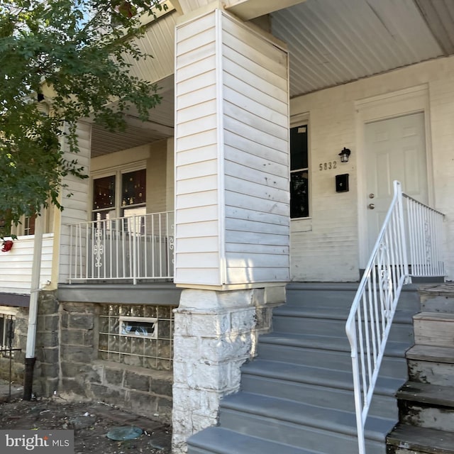 property entrance featuring covered porch