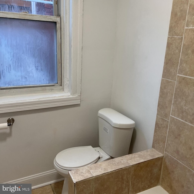 5832 Norfolk St, Philadelphia, PA 19143 - bathroom with toilet, baseboards, and tile patterned floors