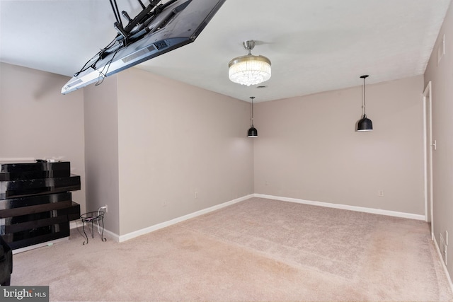 interior space featuring baseboards and carpet