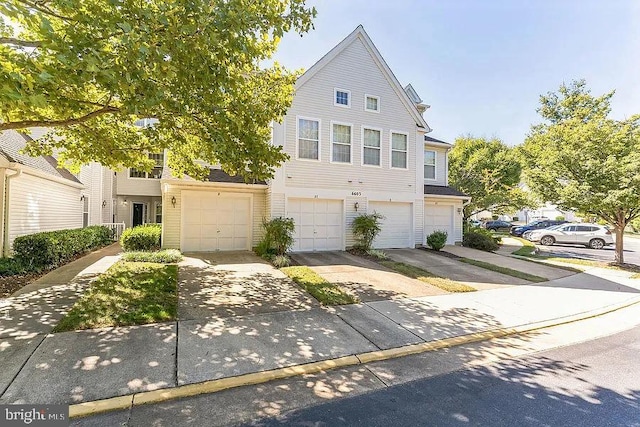 view of property with driveway and an attached garage