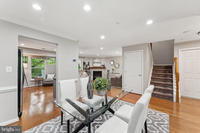 6603 Netties Ln Unit 1706, Alexandria, VA 22315 - dining space featuring light wood-type flooring, recessed lighting, stairs, crown molding, and a fireplace