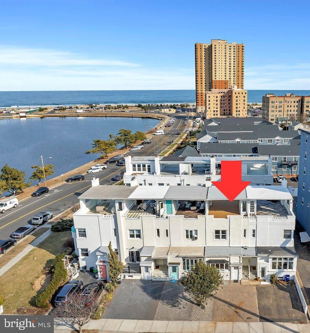 bird's eye view featuring a water view and a city view