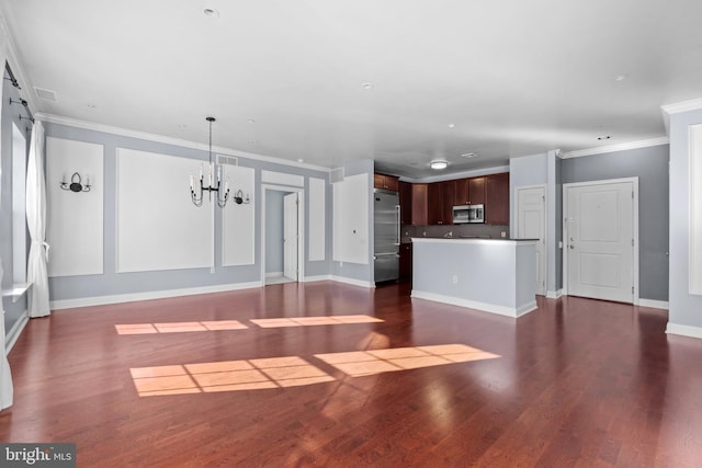 unfurnished living room featuring dark wood finished floors, baseboards, a chandelier, and ornamental molding