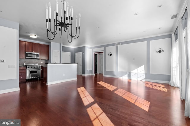 unfurnished living room featuring visible vents, crown molding, baseboards, dark wood finished floors, and a chandelier