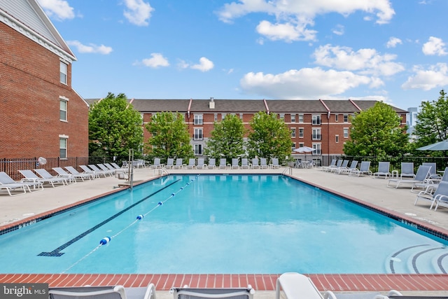 pool featuring a patio and fence