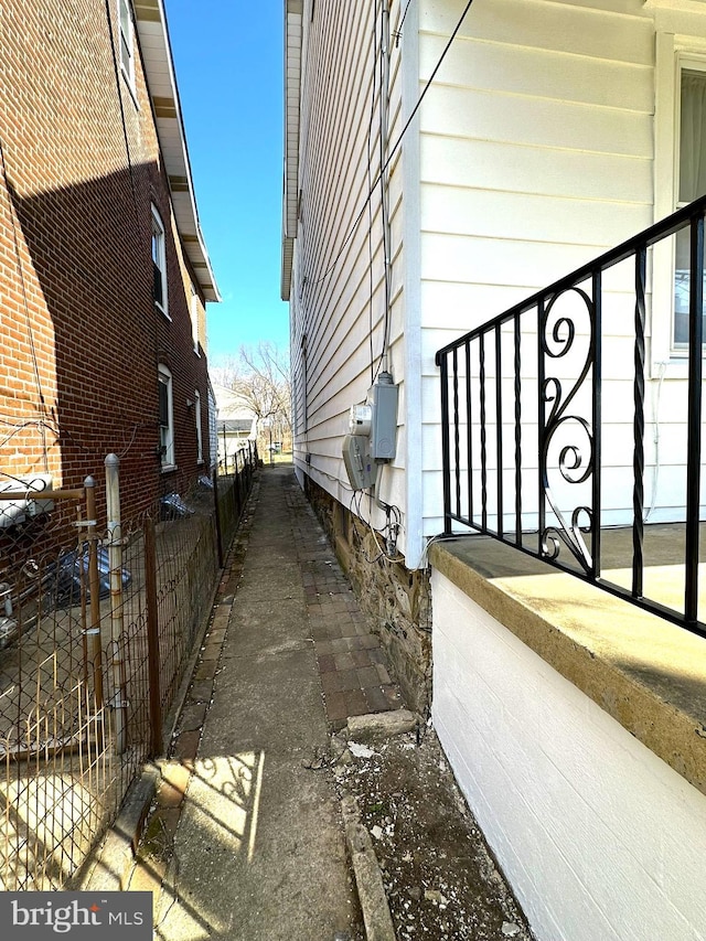 view of side of property featuring fence