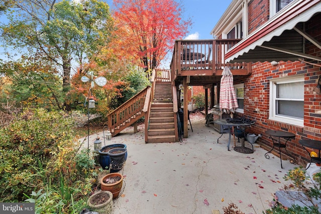 view of patio featuring stairway and a deck