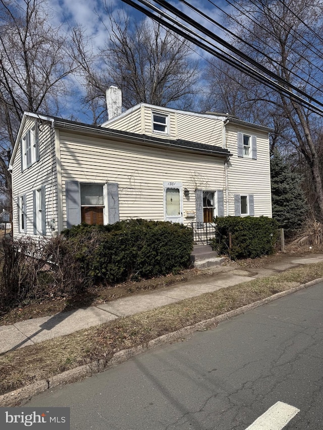 view of front of property with a chimney