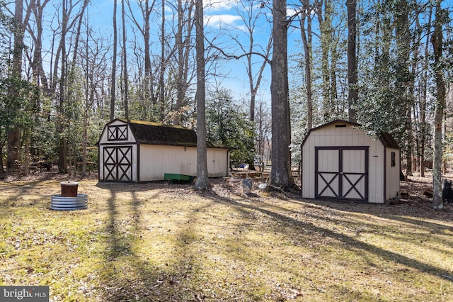 exterior space featuring an outbuilding and a storage shed