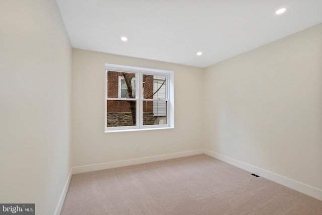 carpeted empty room with recessed lighting and baseboards