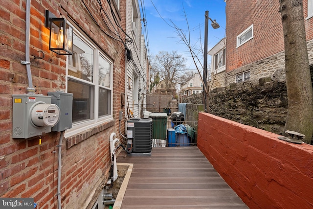 view of side of home featuring central AC