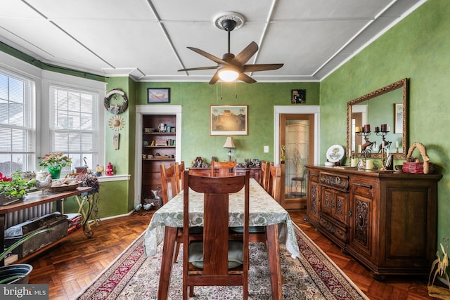 dining room featuring crown molding and ceiling fan