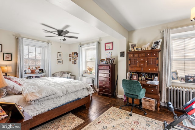 bedroom featuring radiator and dark wood-style floors