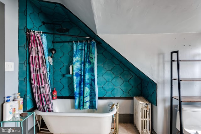 interior space with tile patterned floors and radiator