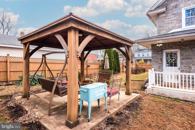 exterior space featuring a gazebo and fence