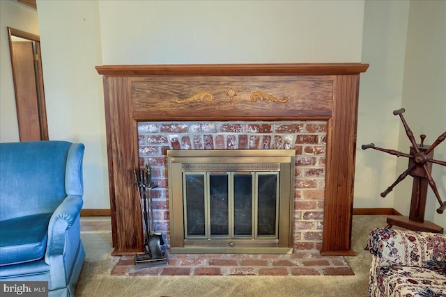 interior details with baseboards, carpet, and a brick fireplace