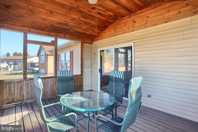 sunroom / solarium featuring wood ceiling and vaulted ceiling