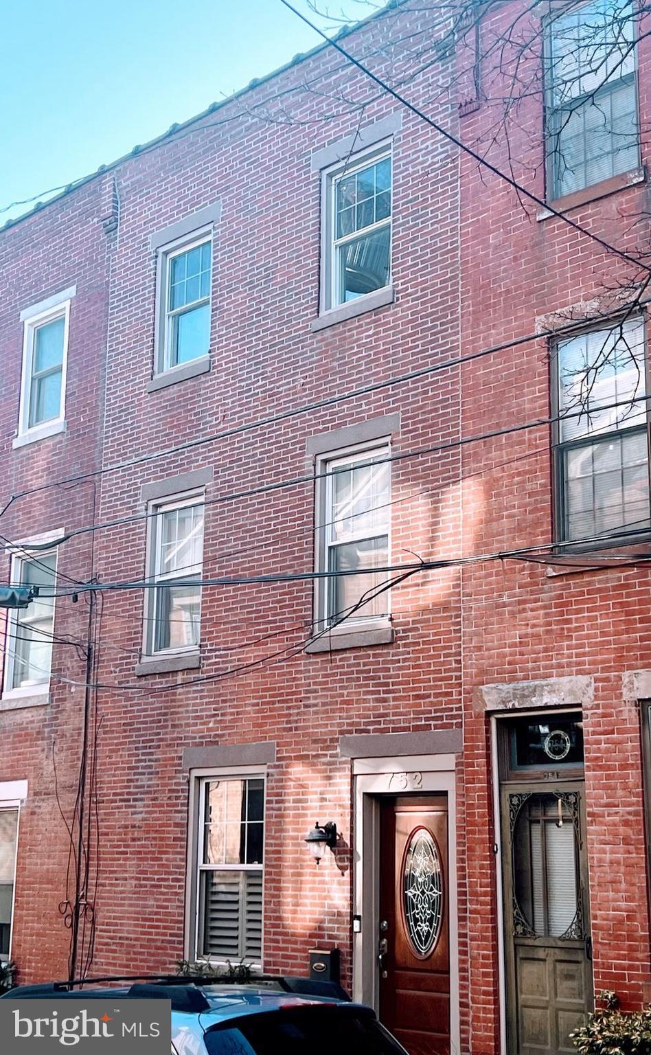 exterior space featuring brick siding