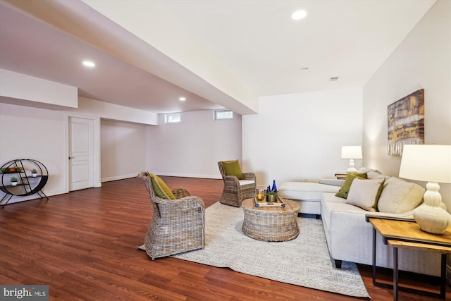 living room featuring recessed lighting, wood finished floors, visible vents, and baseboards