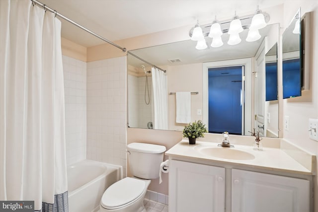 full bath with vanity, toilet, visible vents, and shower / tub combo with curtain