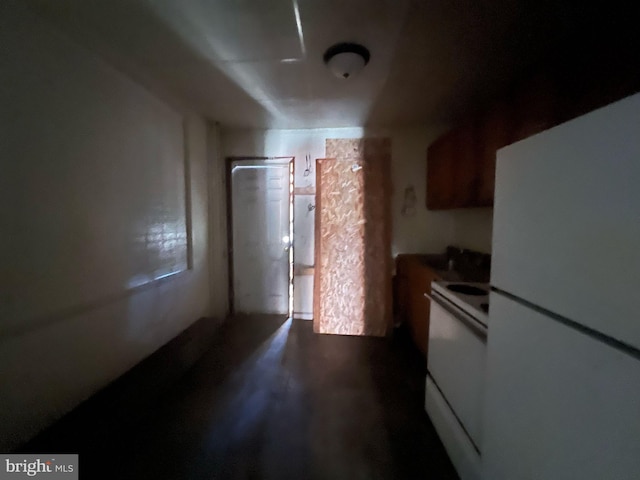 kitchen with range and freestanding refrigerator