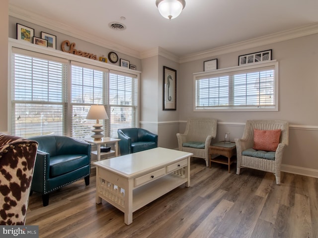 33565 Windswept Dr Unit 10201, Millsboro, DE 19966 - sitting room featuring plenty of natural light, ornamental molding, and wood finished floors